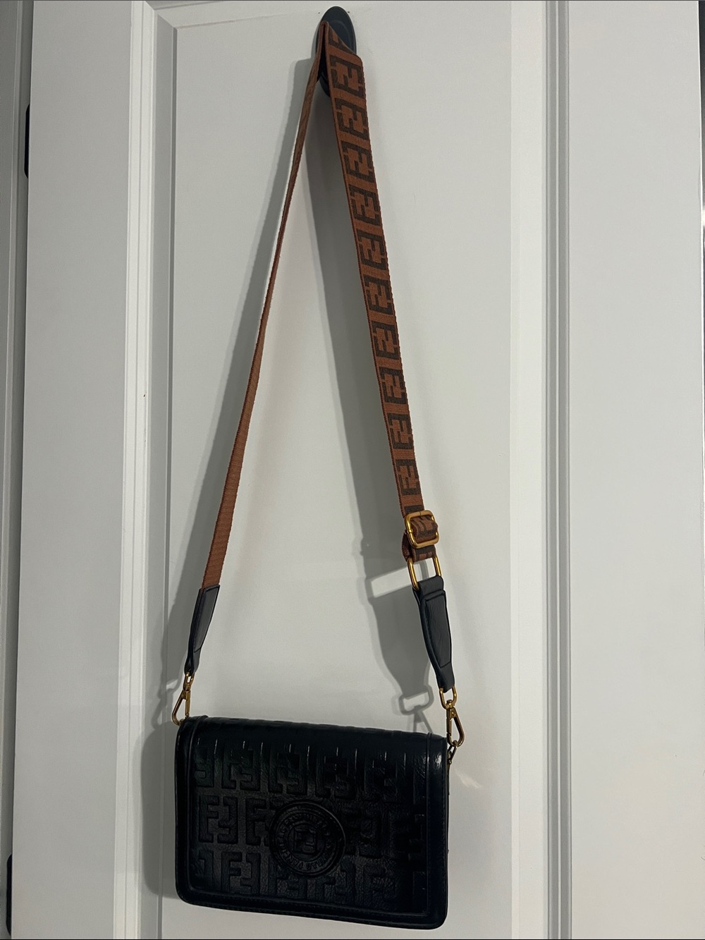 Black Embossed Leather Crossbody Bag with Brown Logo Strap